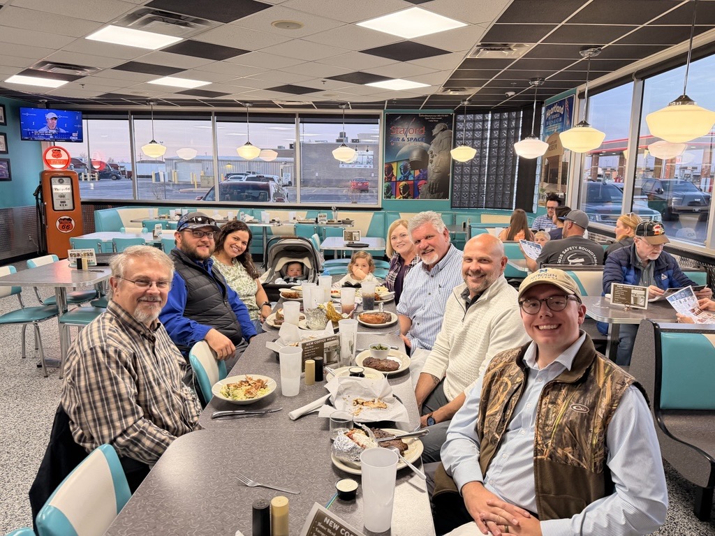 Ray enjoying dinner with clients who are like family
